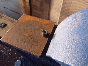 Rivet set in the vice anvil