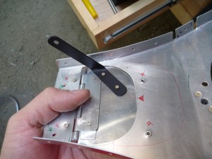 I sprayed a nice enamel coat of paint on the steel arm for the carb heat door, then riveted all of that stuff together.  